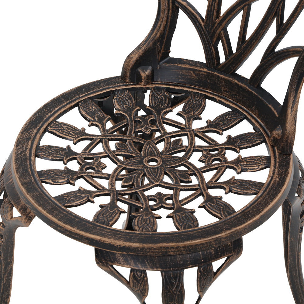 Close-up view of the bronze Gardeon seat part of the chair with intricate cut-out tulip flower patterns, on a white background.