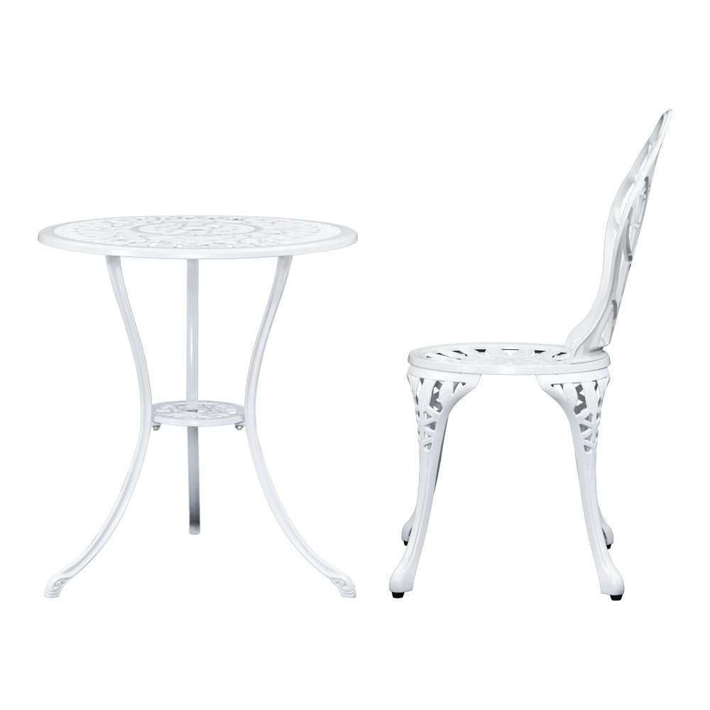 A white Gardeon round table and side view of chair with intricate cut-out tulip flower patterns, on a white background setting.