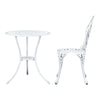 A white Gardeon round table and side view of chair with intricate cut-out tulip flower patterns, on a white background setting.