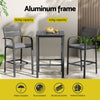 Outdoor furniture set with table and chairs on a patio, featuring an aluminum frame.