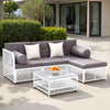 Outdoor patio set with gray cushions and white lattice design on a patio.