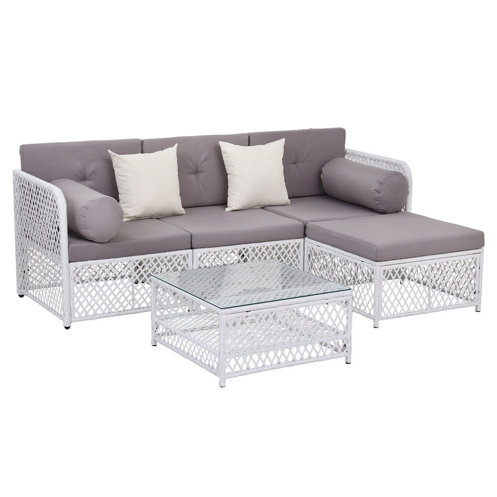 Outdoor furniture set with a sectional sofa and coffee table on a white background