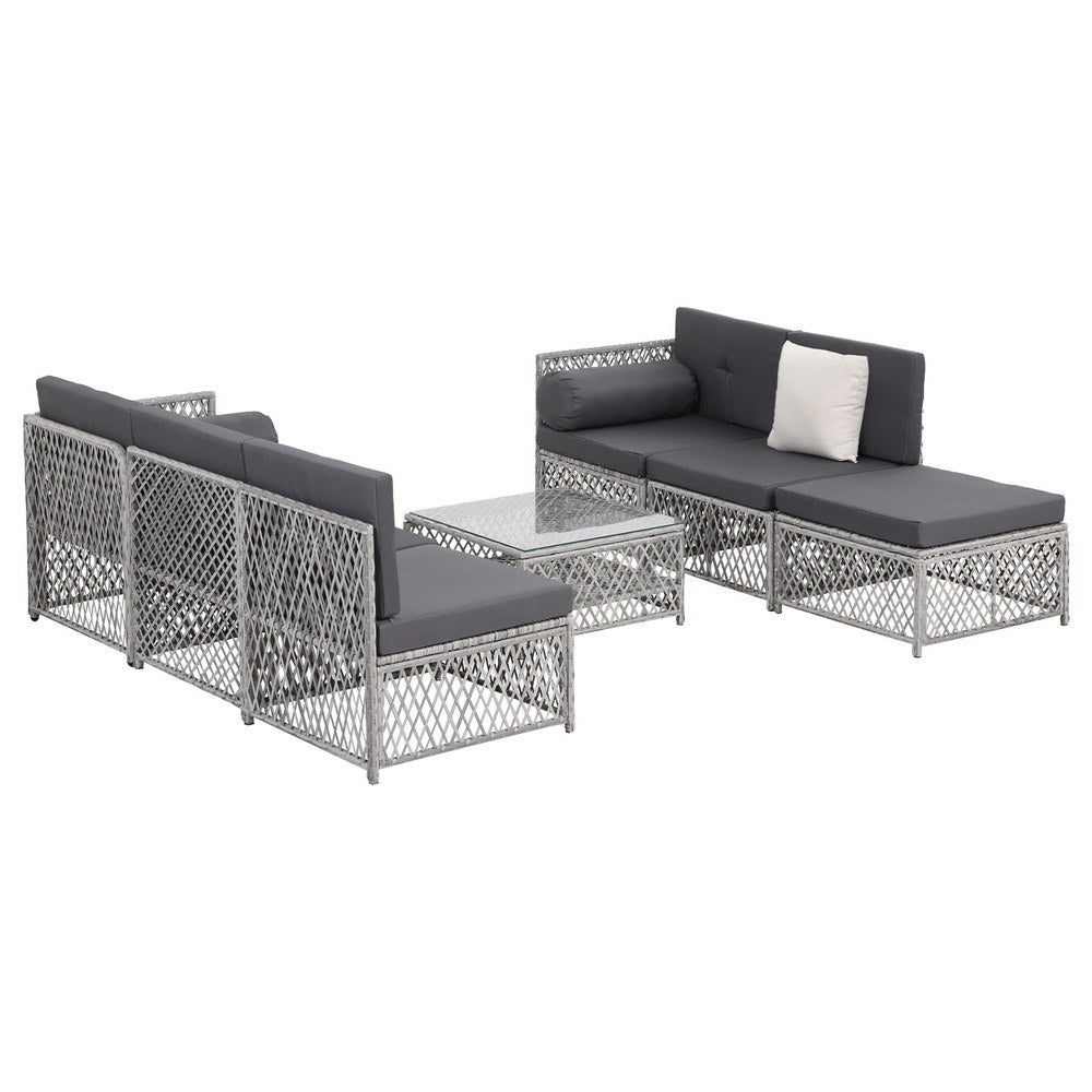 Outdoor furniture set with gray cushions on a white background