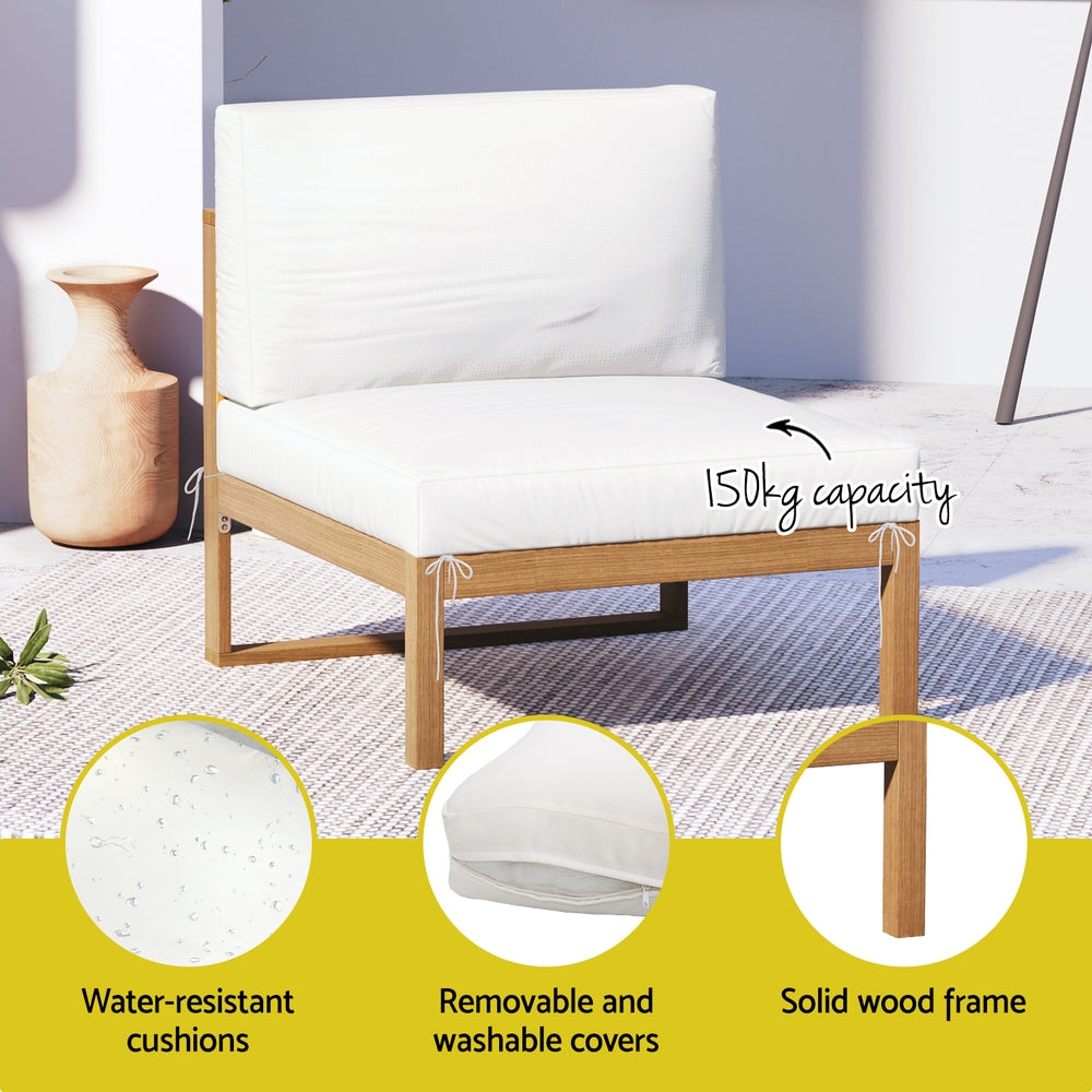 White cushioned chair with wooden frame on a patio, featuring water-resistant cushions and solid wood frame.