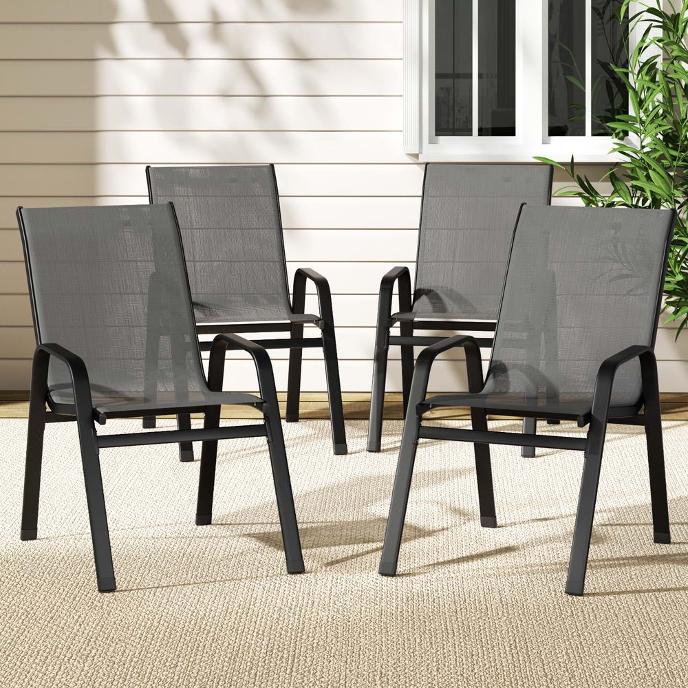 Four gray outdoor chairs on a patio with a neutral background