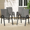 Four gray outdoor chairs on a patio with a neutral background