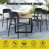 Outdoor dining set with weather-resistant design features on a patio.