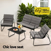 Outdoor furniture set with a love seat, two chairs, and a table in a garden setting.