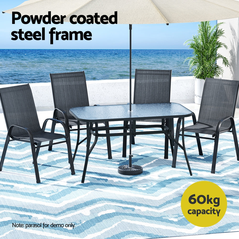 Outdoor furniture set with table and chairs by the sea, featuring a powder-coated steel frame.