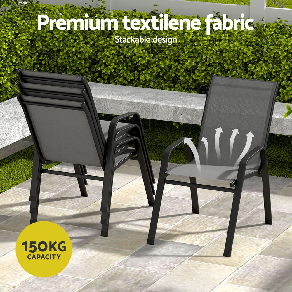 Two black chairs with textilene fabric on a patio area, featuring a stackable design and 150KG capacity label.
