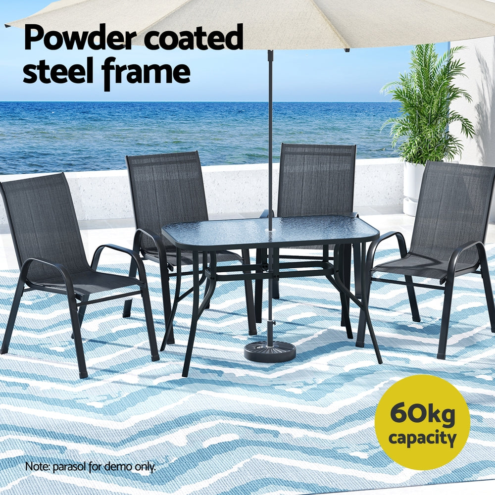 Outdoor furniture set with table and chairs on a patio with ocean view, featuring text about powder-coated steel frame and capacity.