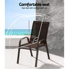 An outdoor dining chair in brown made of metal and plastic, stackable with anti-slip feet, showing the high back seat with a comfortable angle for sitting, and set on a tiled balcony with a marble wall and an ocean view in the background.