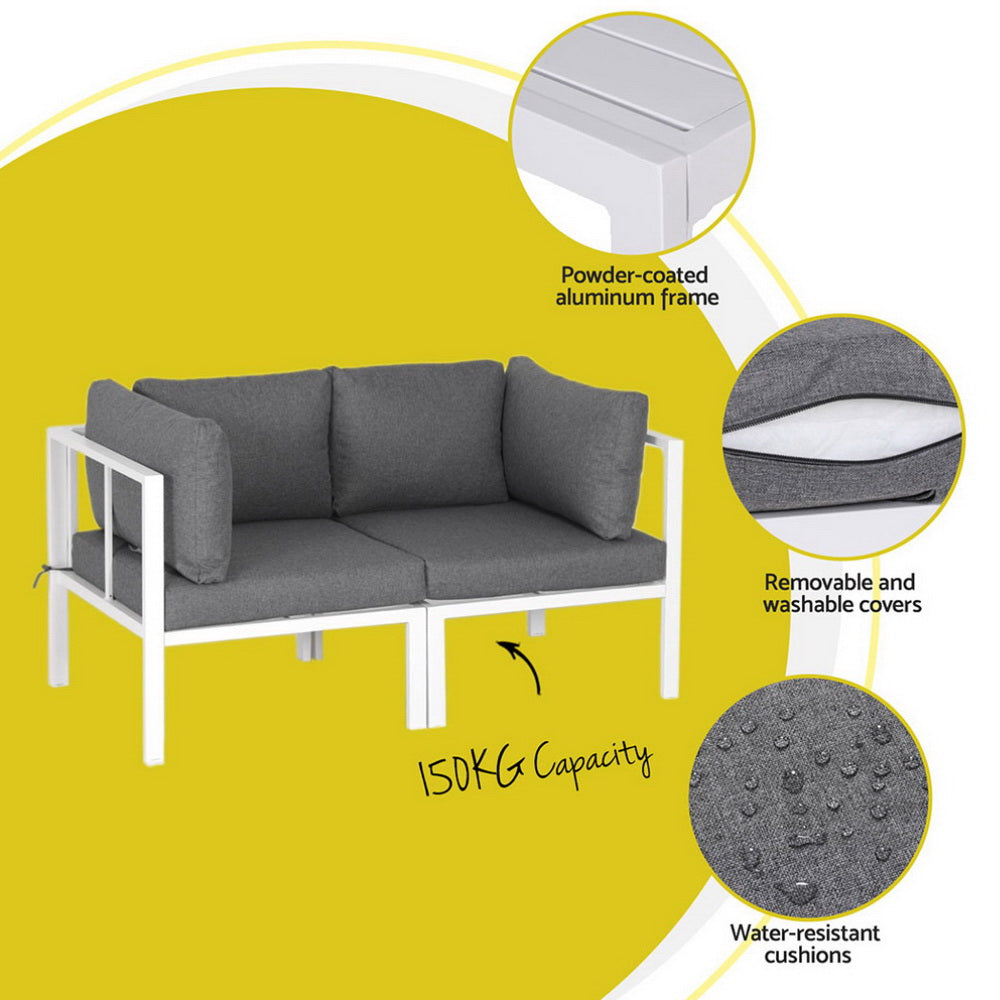 Gray outdoor sofa with white frame on a yellow background, featuring powder-coated aluminum frame, removable and washable covers, and water-resistant cushions.