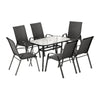 Outdoor dining set with a table and six chairs on a white background