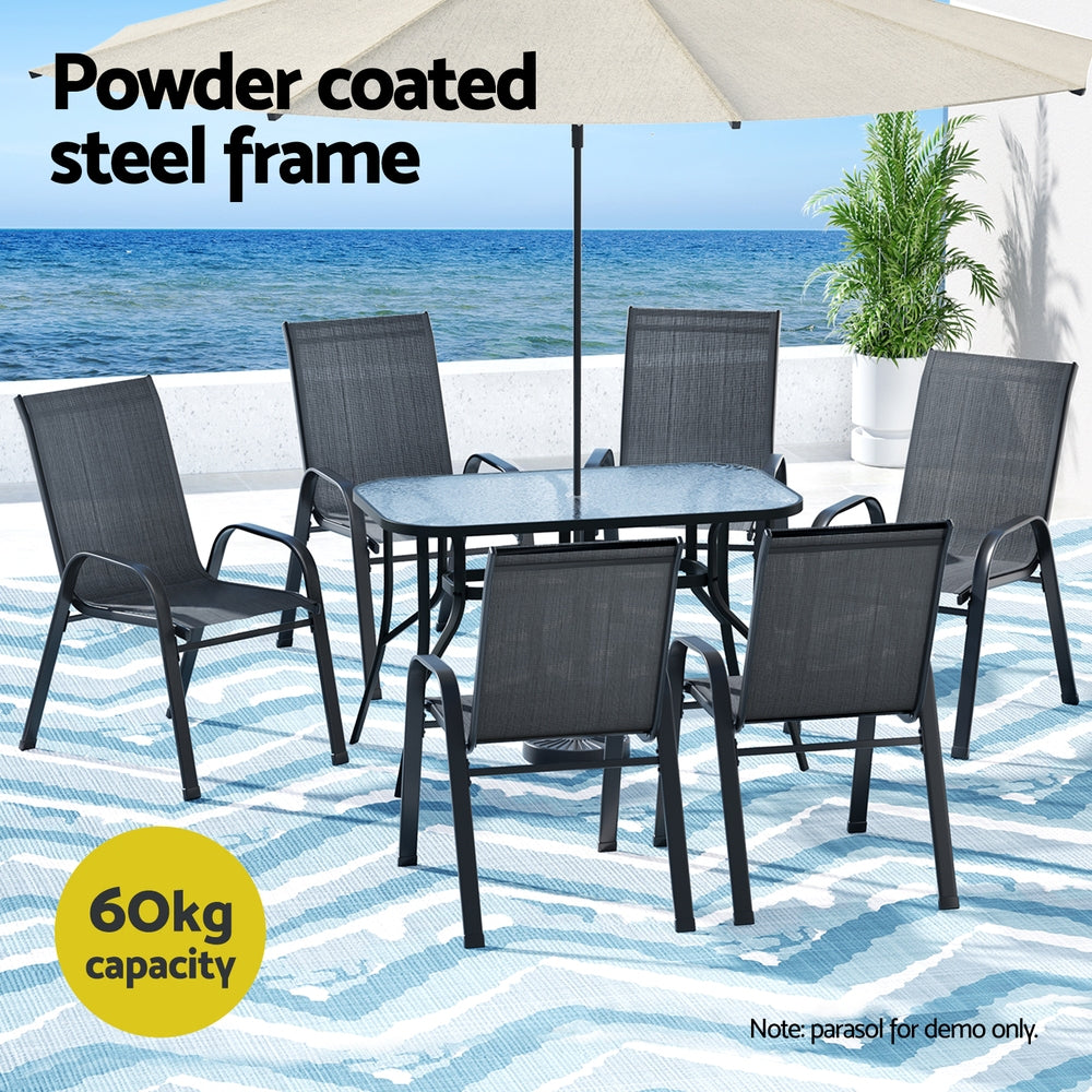 Outdoor furniture set with table and chairs by the sea, featuring a powder-coated steel frame.