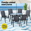 Outdoor furniture set with table and chairs by the sea, featuring a powder-coated steel frame.