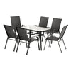 Outdoor dining set with a round table and six chairs on a white background
