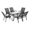 Outdoor furniture set with a table and six chairs on a white background