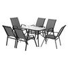 Outdoor furniture set with a round table and six chairs on a white background