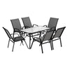 Outdoor dining set with a table and six chairs on a white background