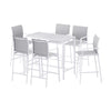 White dining table with six matching chairs on a white background