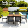 Outdoor dining set with powder-coated metal frame and slatted desktop, set against a poolside background.