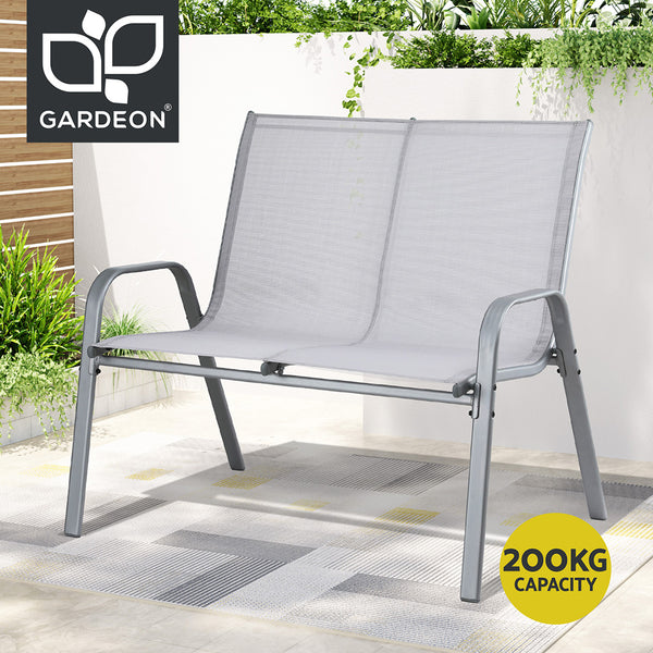 Gray outdoor bench with Gardeon logo and capacity label on a patio background