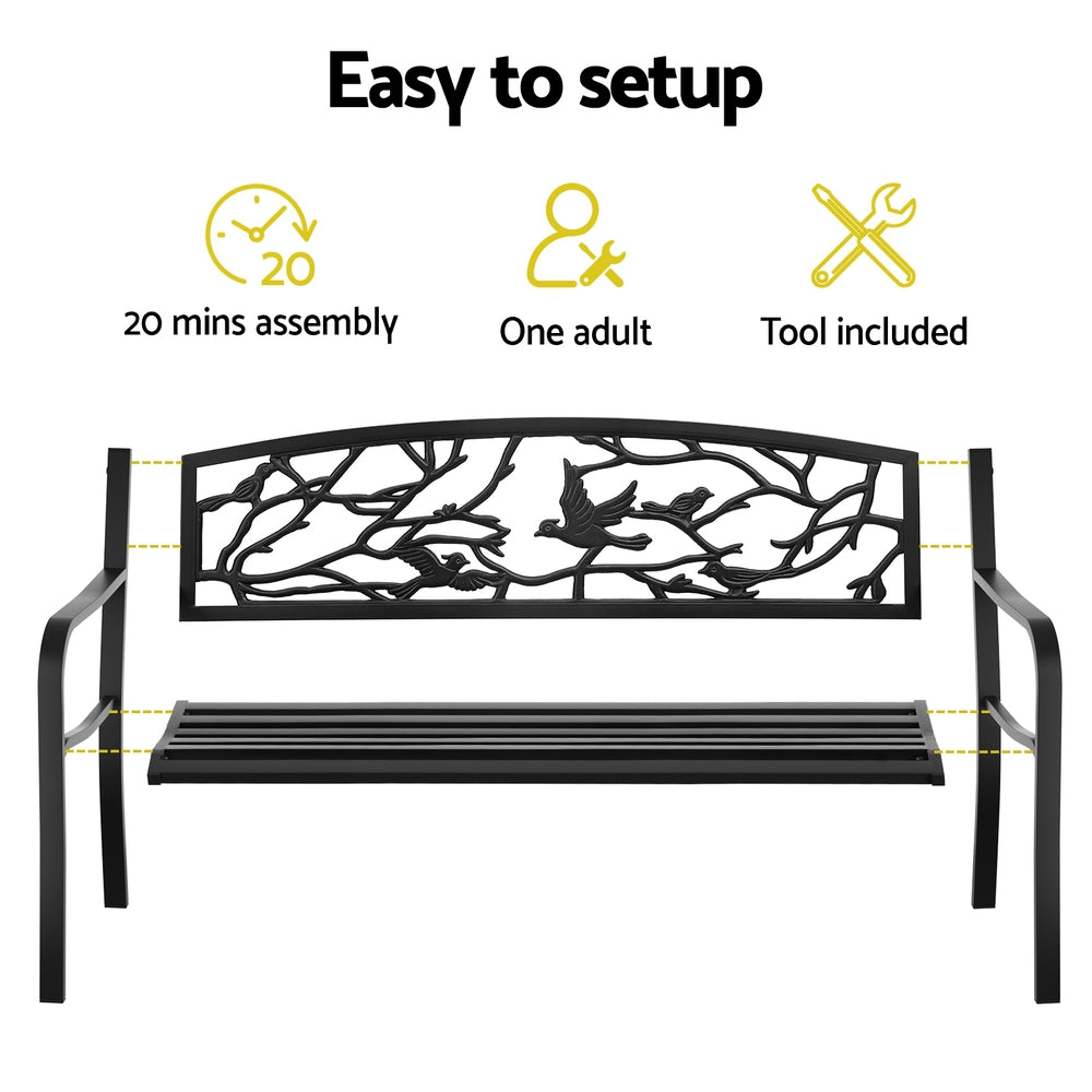 Black metal bench with decorative design, assembly instructions, and tool included on a white background.