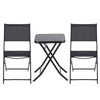 Black folding table with two matching chairs on a white background