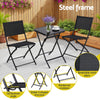 Black metal outdoor furniture set with table and chairs on a patio, featuring steel frame details.