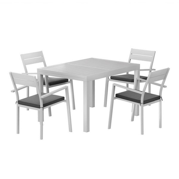 White outdoor table with four matching chairs on a white background