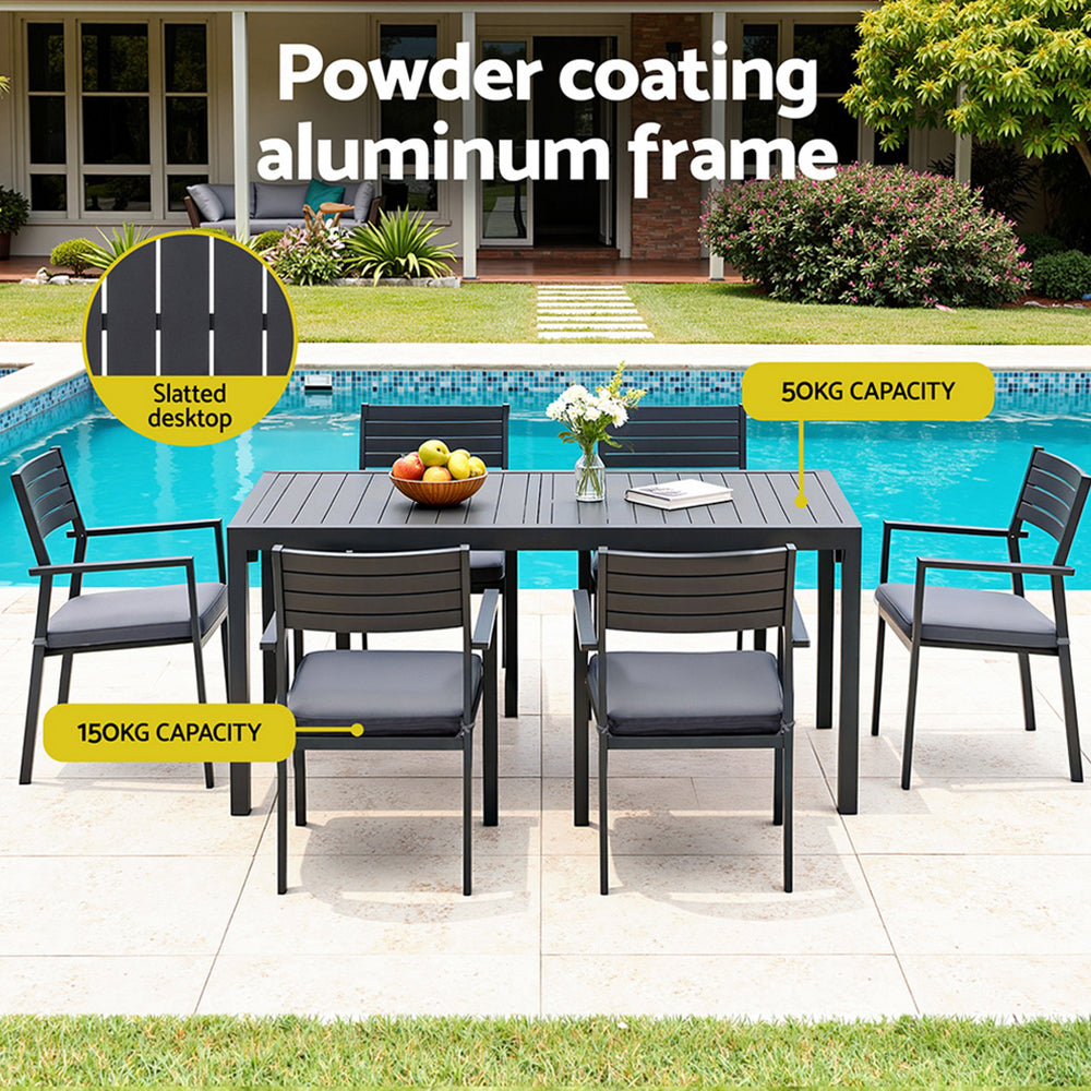 Outdoor patio set with table and chairs by a pool, featuring powder-coated aluminum frame.