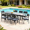 Outdoor dining set with table and chairs by a poolside