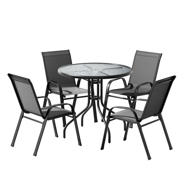 Outdoor furniture set with a round glass table and four chairs on a white background