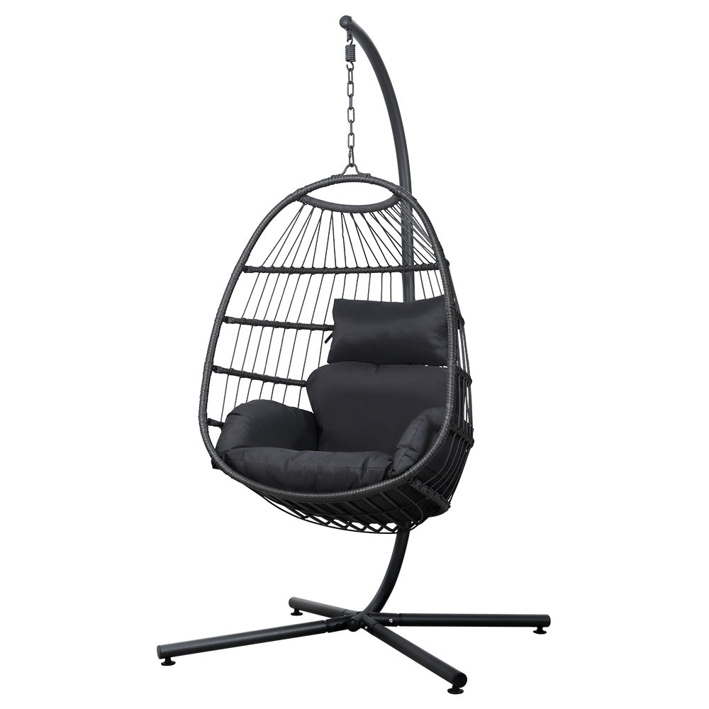 Black hanging egg chair with cushions on a white background