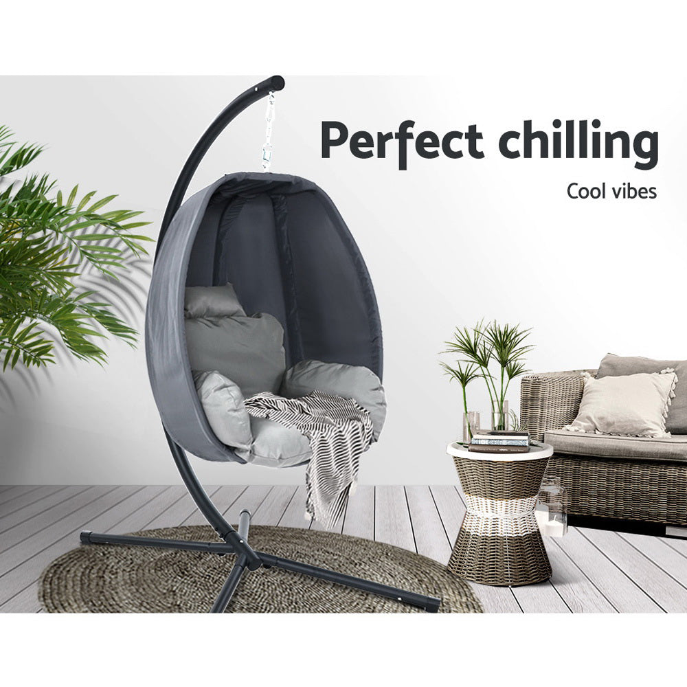 Hanging egg chair with a plant and sofa in the background, labeled 'Perfect chilling'.