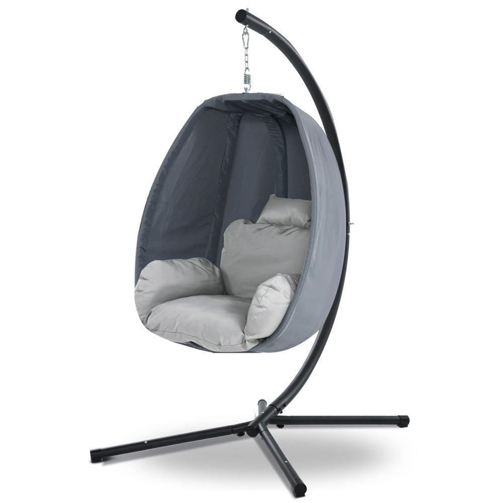 Hanging egg chair with gray cushion on a white background