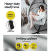 Hanging chair with text highlighting heavy-duty steel frame and inviting cushion features.