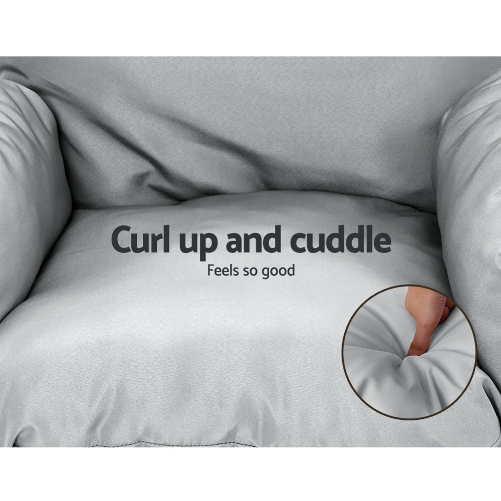 Gray pillow with text ' Curl up and cuddle Feels so good' on a gray background