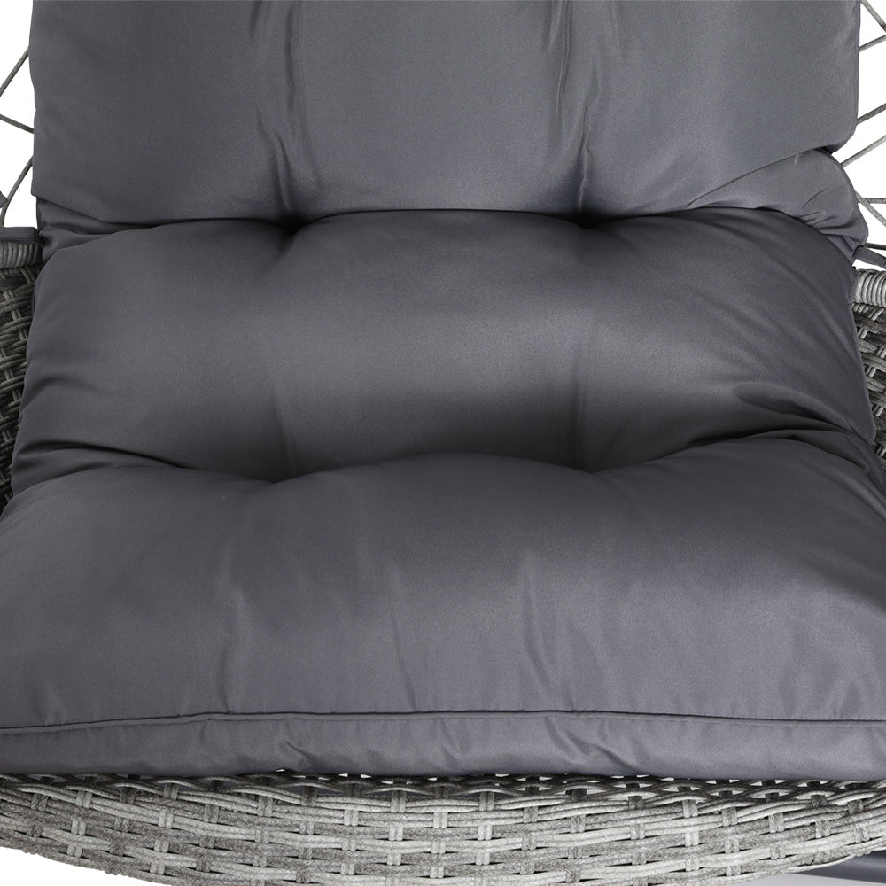 View of the charcoal colour cushion of a grey wicker egg chair.