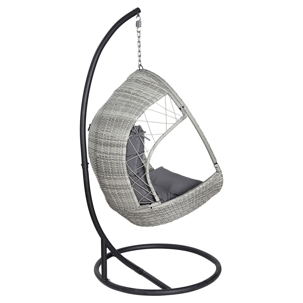 Side/back view of an outdoor egg swing chair with a grey wicker frame, charcoal stand and cushions on a white background.