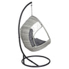 Side/back view of an outdoor egg swing chair with a grey wicker frame, charcoal stand and cushions on a white background.