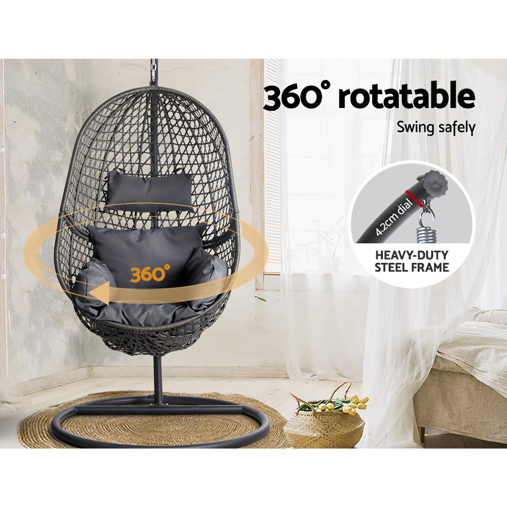 360-degree rotatable egg-shaped hanging chair with a heavy-duty steel frame in a room setting.