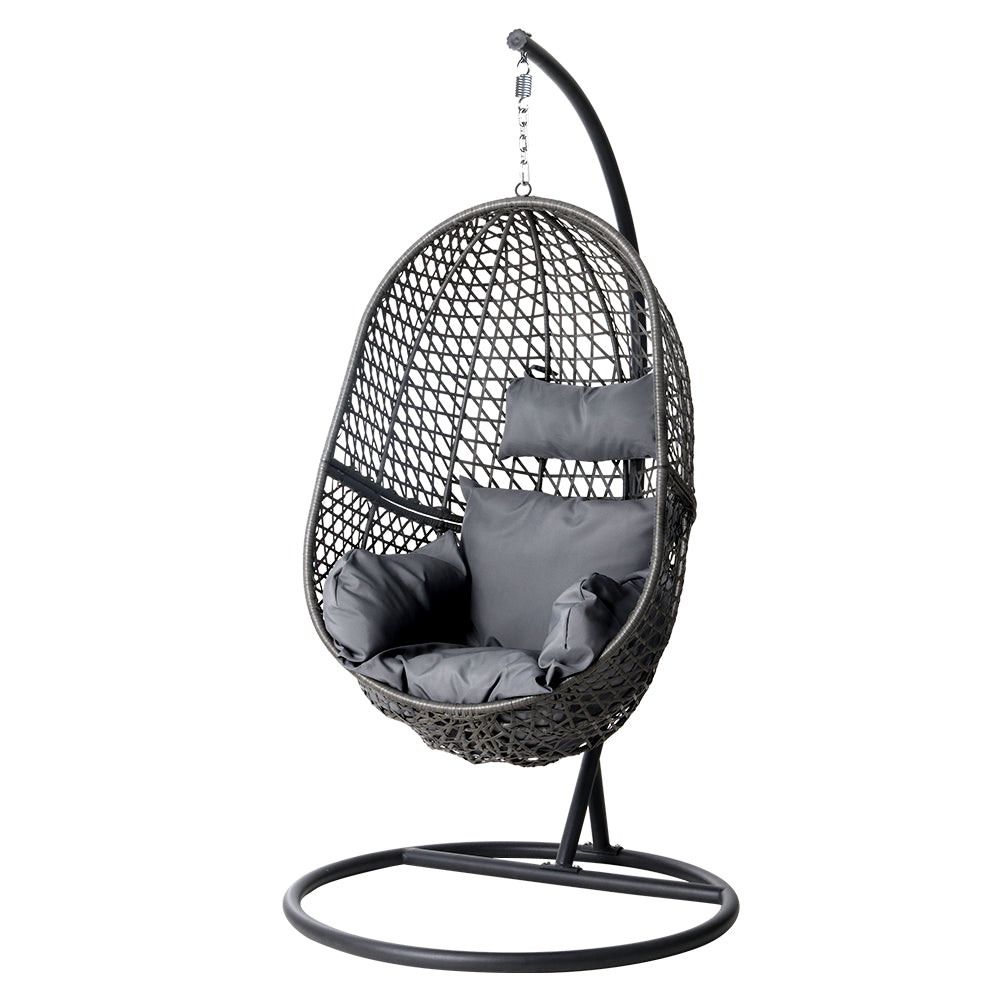 Gray woven hanging chair with cushions on a white background