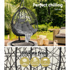 Hanging egg chair with cushions in a garden setting, featuring text about 'Perfect chilling' and product features.