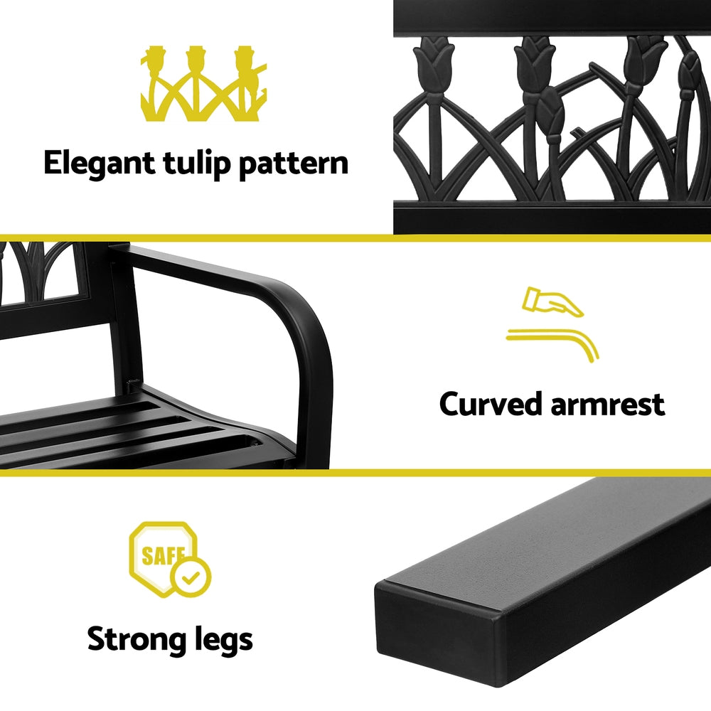 Black metal chair with tulip pattern, curved armrest, and strong legs on a white background.