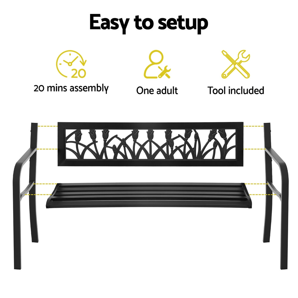 Black metal bench with decorative backrest, assembly instructions, and tool included on a white background.