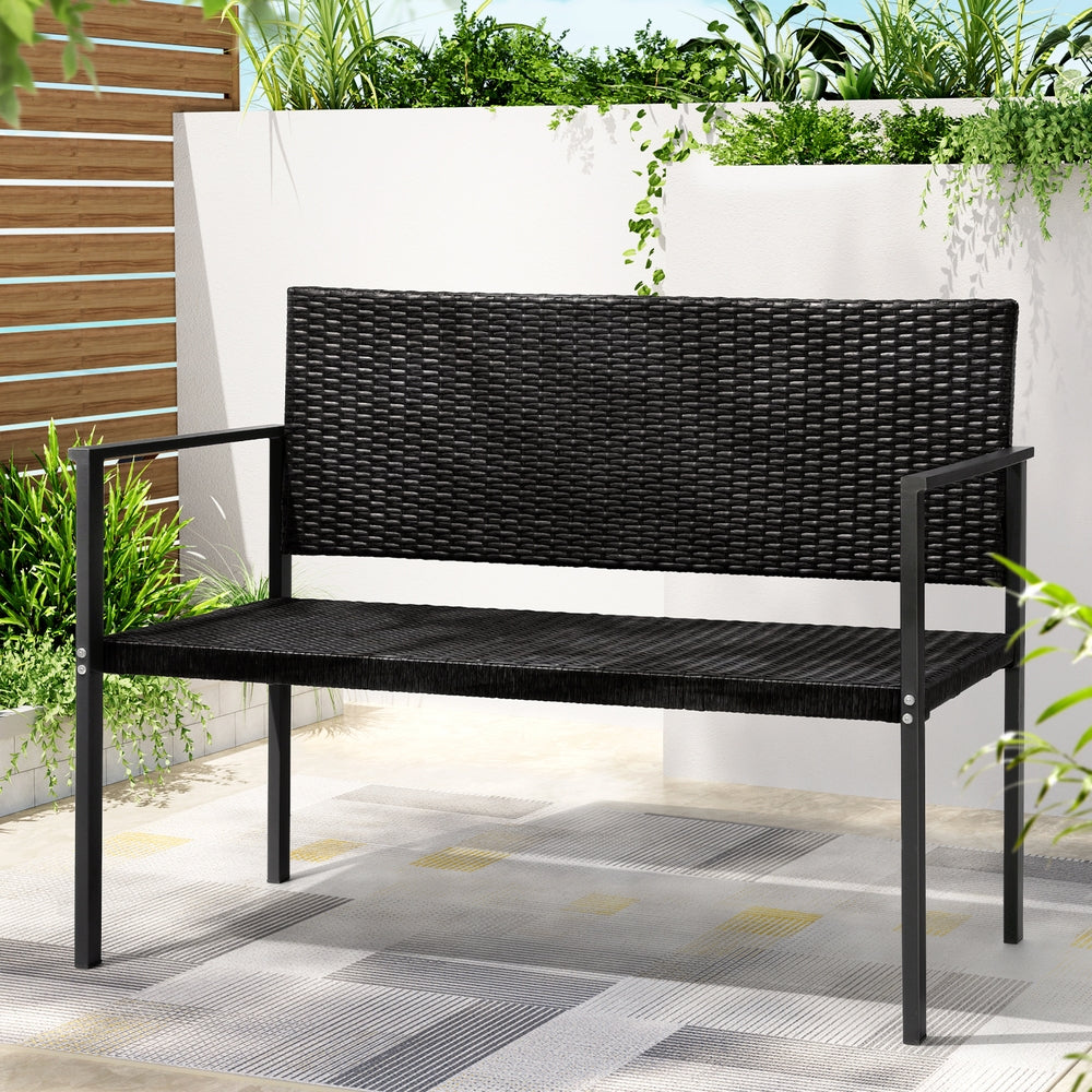 A 2-seater Gardeon outdoor garden bench with a grey rattan seat and black powder-coated steel frame in an outdoor setting. 