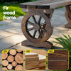 Wooden bench with wheel design on a stone patio, featuring close-up images of fir wood.