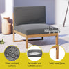 Gray cushioned chair with water-resistant cushions, removable covers, and solid wood frame on a patio.